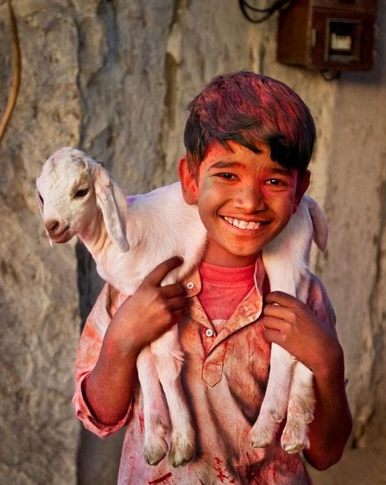 kid in holi colors